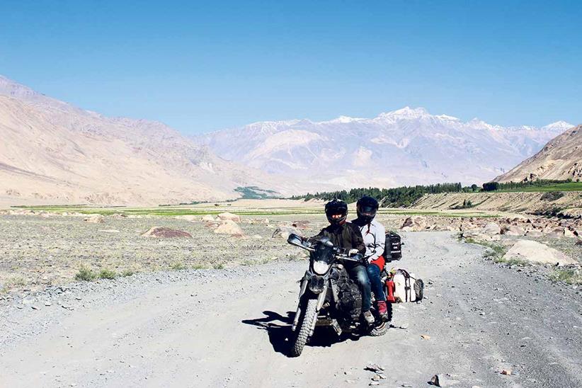 Andy and Alissa riding through Afghanistan