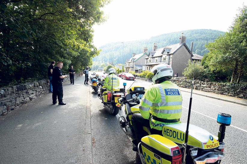 Two riders are pulled over