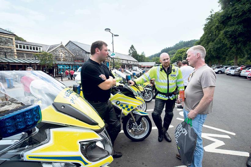 Police speak to riders at a local biking haunt