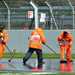 Marshals sweep water from the track at Silverstone 2018