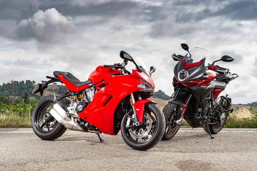 Not exactly two peas in a pod, the Ducati and the MV Agusta pose for pics