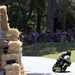 Bales of hay protect riders from a statue in Wales