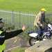 An officer sprays DNA at a motorcyclist