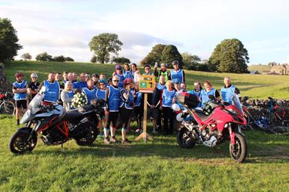 The cycle group pictured with a defibrillator