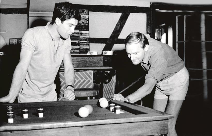 Mike Hailwood teaching Ago the finer points of bar billiards in 1965