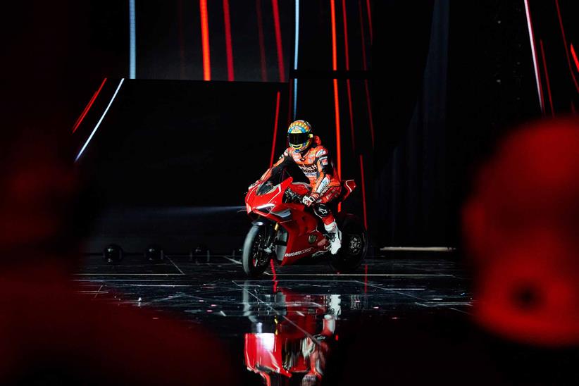 Chaz Davies rides the new Ducati V4R onto the stage