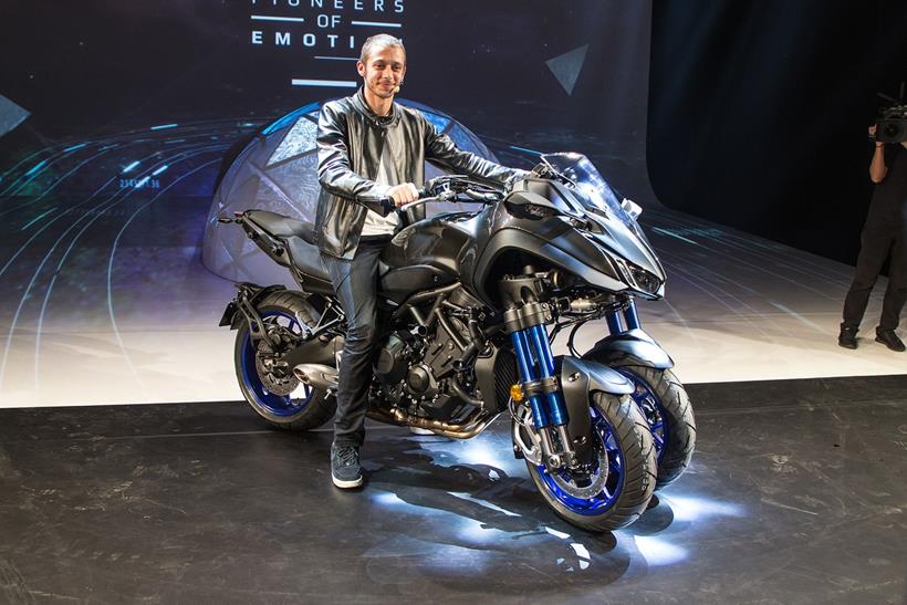 Valentino Rossi poses on the Yamaha Niken at EICMA 2017