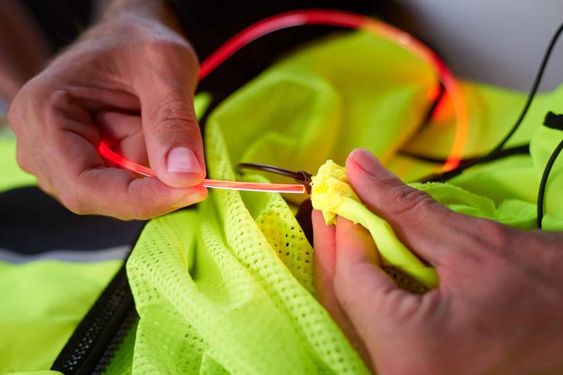 Feed the LED tubes through pockets in the garment