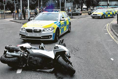 Met Police officer who knocked a suspect off a moped is cleared of wrongdoing