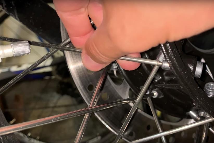 Tapping spokes with a metal bar or spanner should result in a clean tight 'ping'