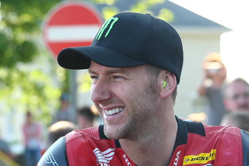 Ian Hutchinson smiles on ahead of a race