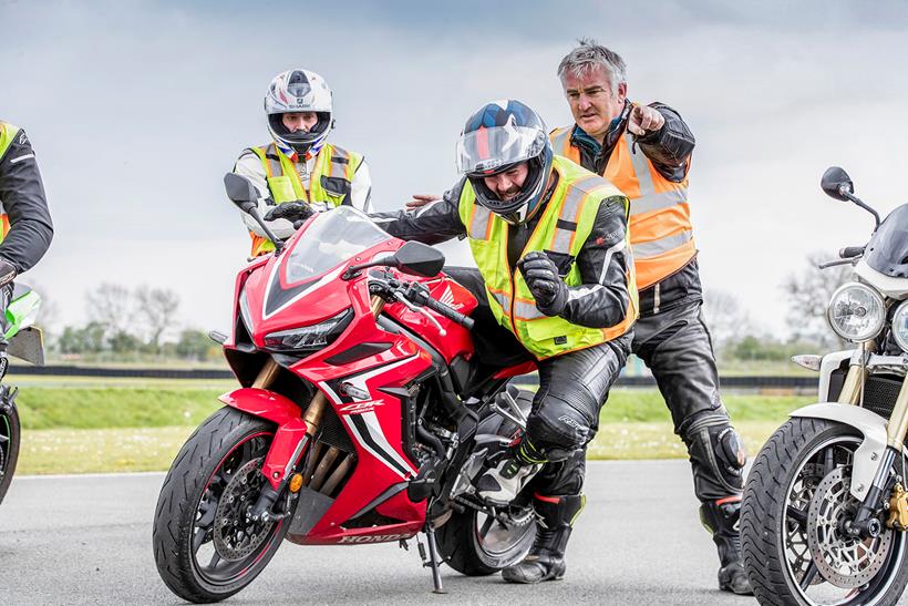 Learning body position for knee down cornering