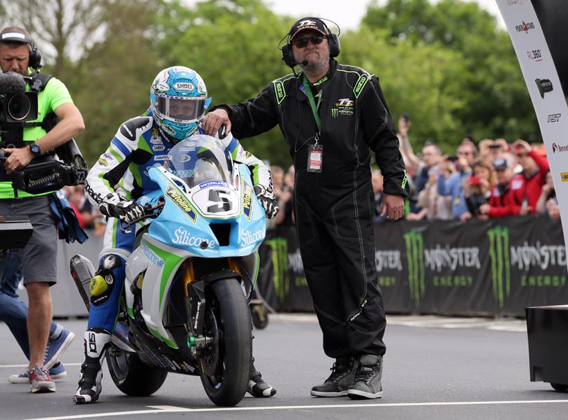 Dean Harrison at the TT start line with Paul Kermode