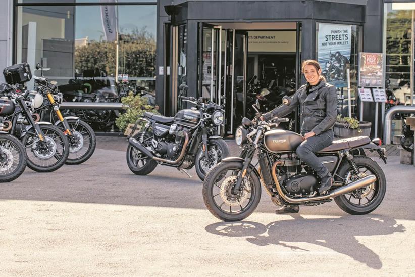 Emma sits with the Triumph Street and Speed Twins