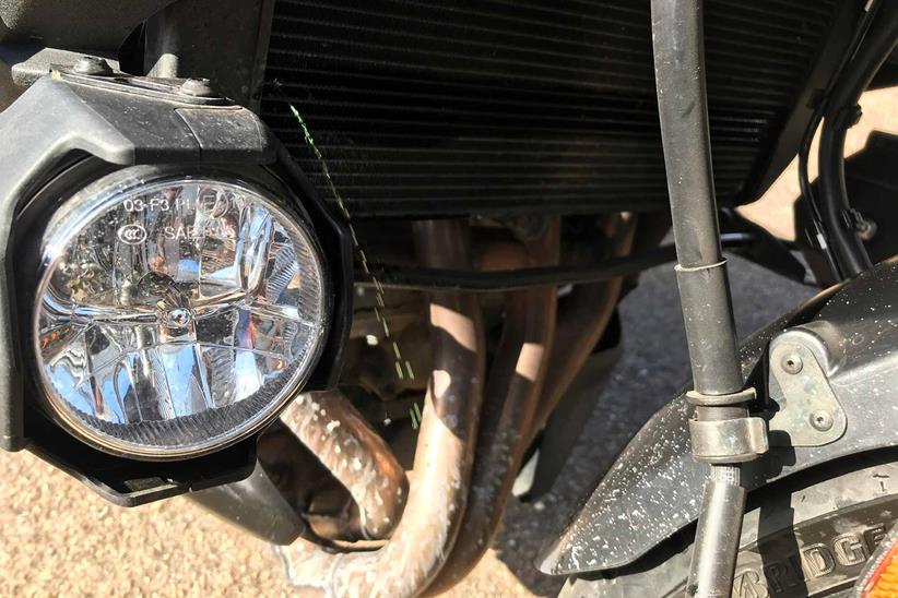 A pierced radiator stops play on the Versys