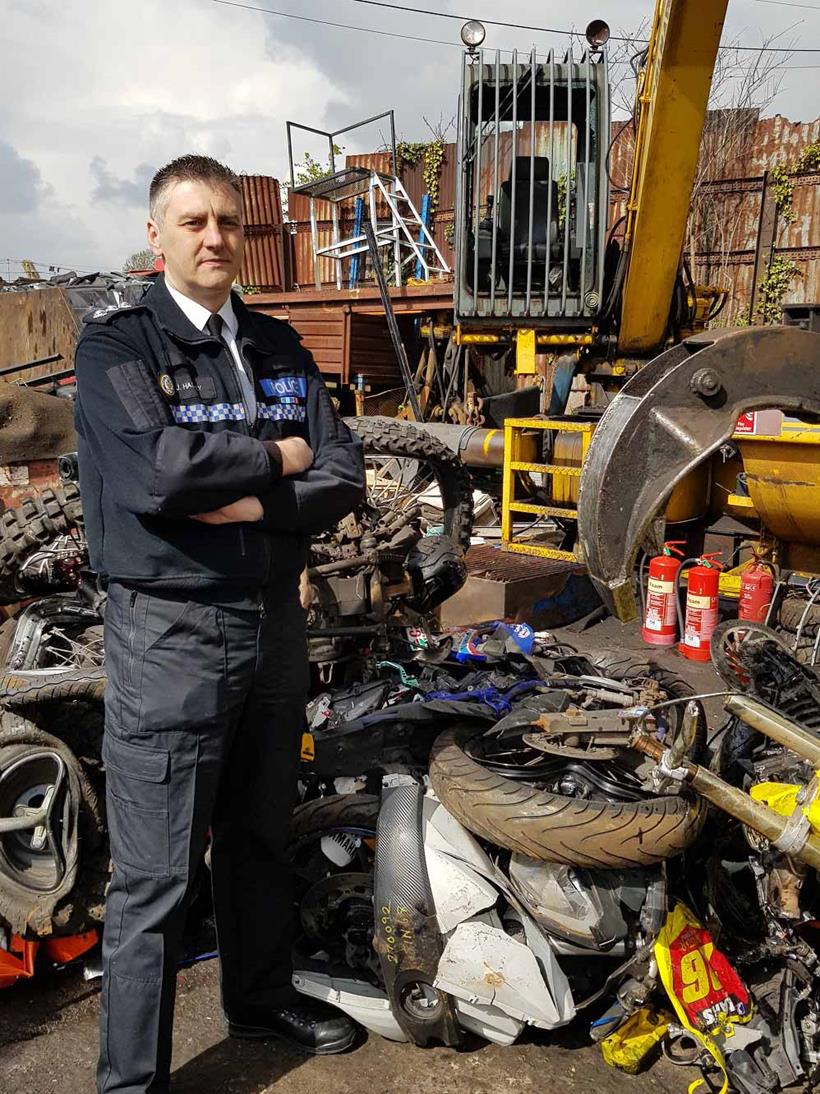 Chief Insp. Hadley with the remains of one of the crushed machines