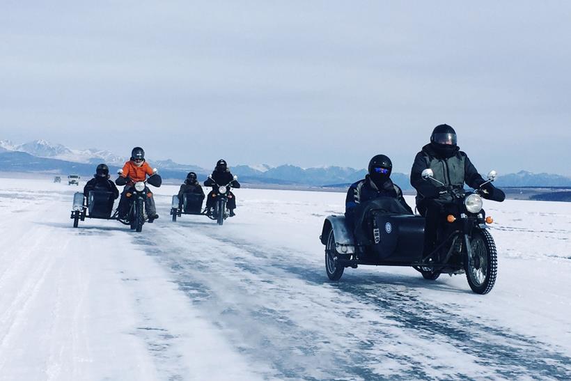 Motorbikes and sidecars on the frozen lakes of Mongolia