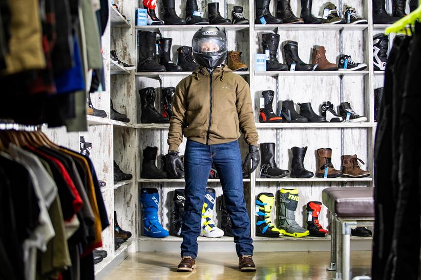 Rider trying on clothes in Sportsbike Shop