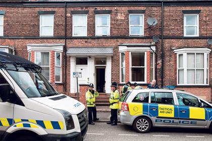 Officers from two police forces raid properties