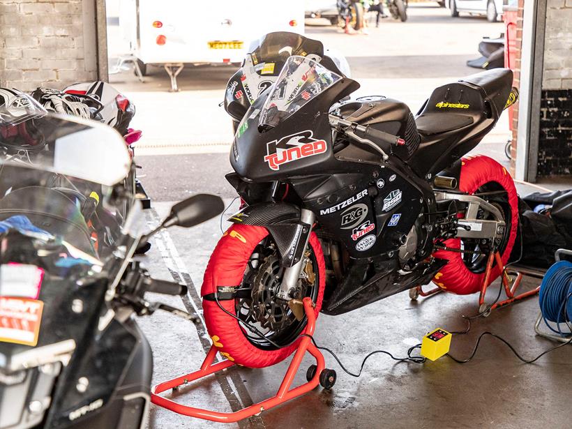 CBR600RR on tyre warmers in pit lane