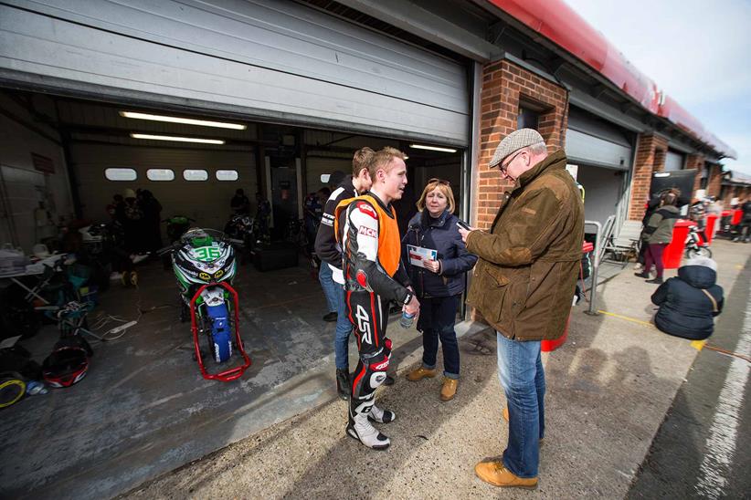 Talking to friends and family outside the garage