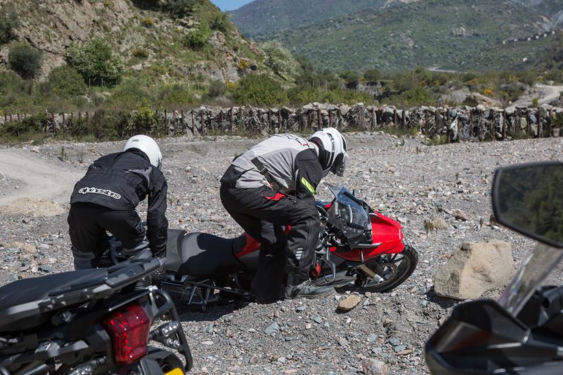 Picking the bike up will almost certainly be necessary at some point if you're riding your bike off road