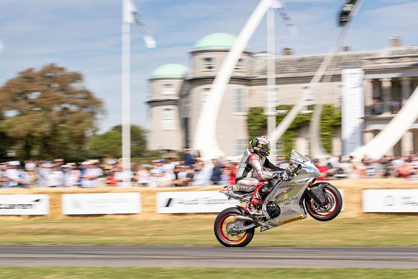 John McGuinness wheelies to the crowd