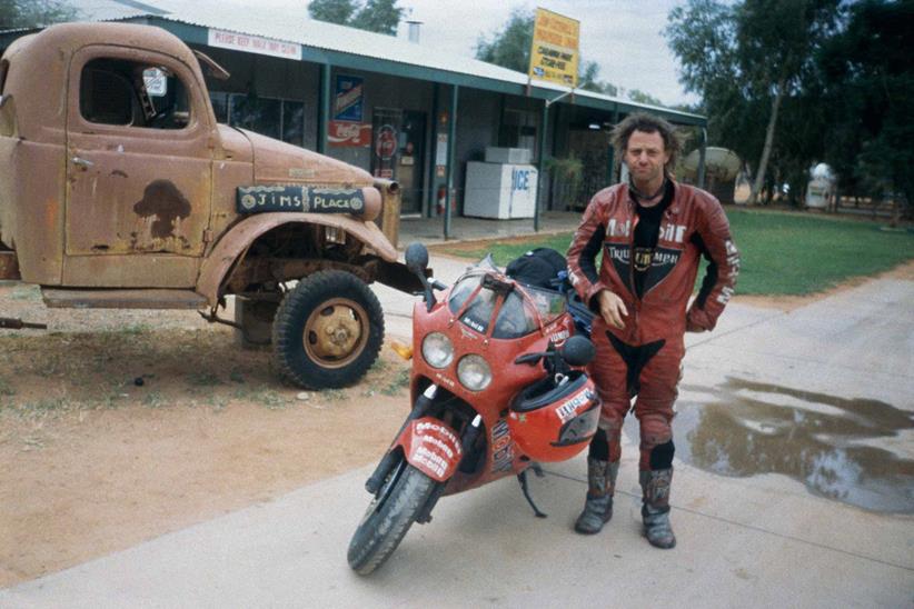 Nick Sanders poses with a Triumph Daytona on a previous adventure