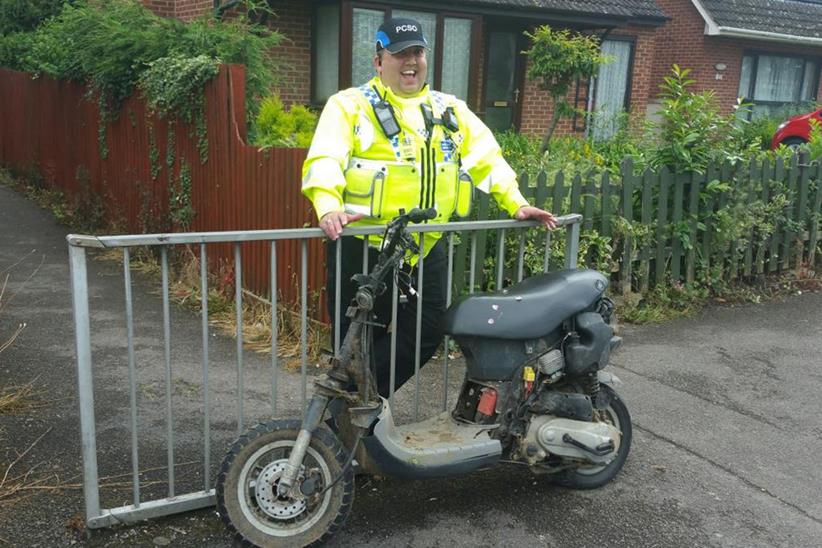 PCSO Slade with the seized moped