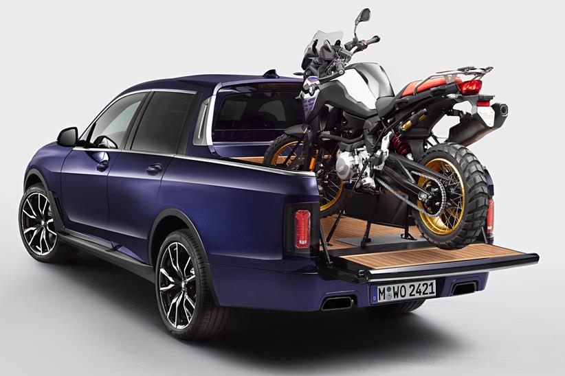 A pickup that won't be built, carrying an adventure motorbike, inspired by a yacht and built by trainees