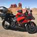 The Kawasaki Z1000SX in front of some striking desert rock formations 