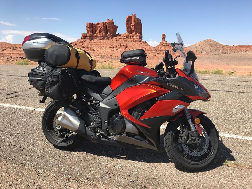 The Kawasaki Z1000SX in front of some striking desert rock formations 