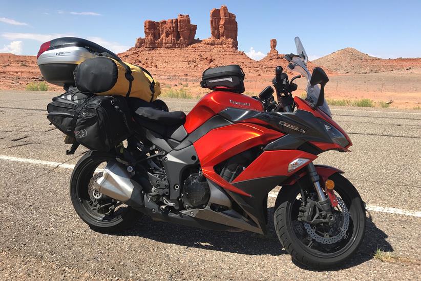 The Kawasaki Z1000SX in front of some striking desert rock formations 