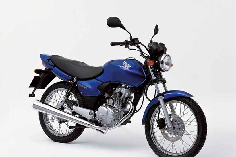 A 2005 Honda CG125 static shot of a blue bike with a white back ground