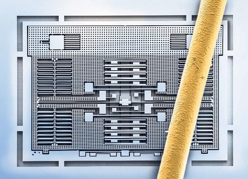 A MEMS system compared with a human hair