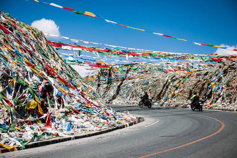 Prayer flags line the road