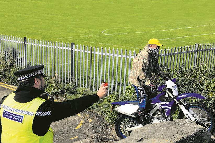 A police officer uses DNA spray