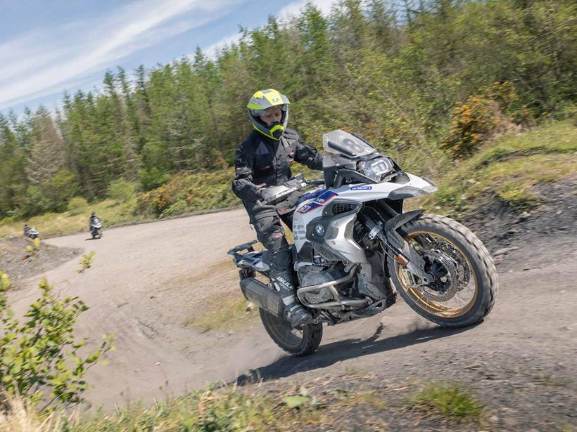 Riding a BMW R1250GS up a dirt hill