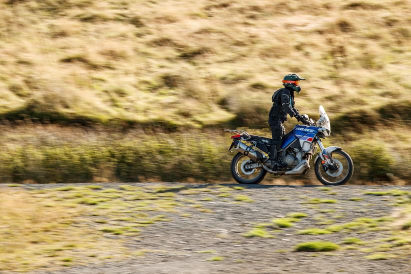 2022 Aprilia Tuareg 660 riding on a gravel trail