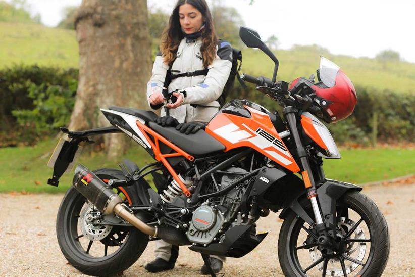 The KTM 125 Duke being a good glove rest for Maria