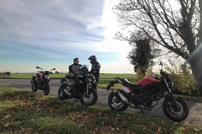 KTM 125 Duke in the countryside with two other bikes