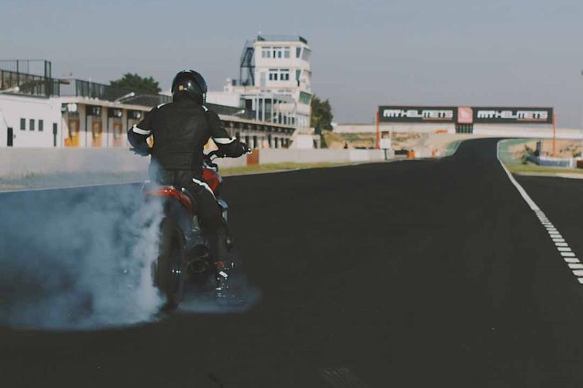 Triumph's test rider performs a burnout on the Rocket 3 R