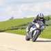 BMW S1000RR ridden at speed on road cornering, testing the handling