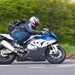 Side-on cornering shot of Editor Richard Newland on his 2015 BMW S1000RR superbike long-termer