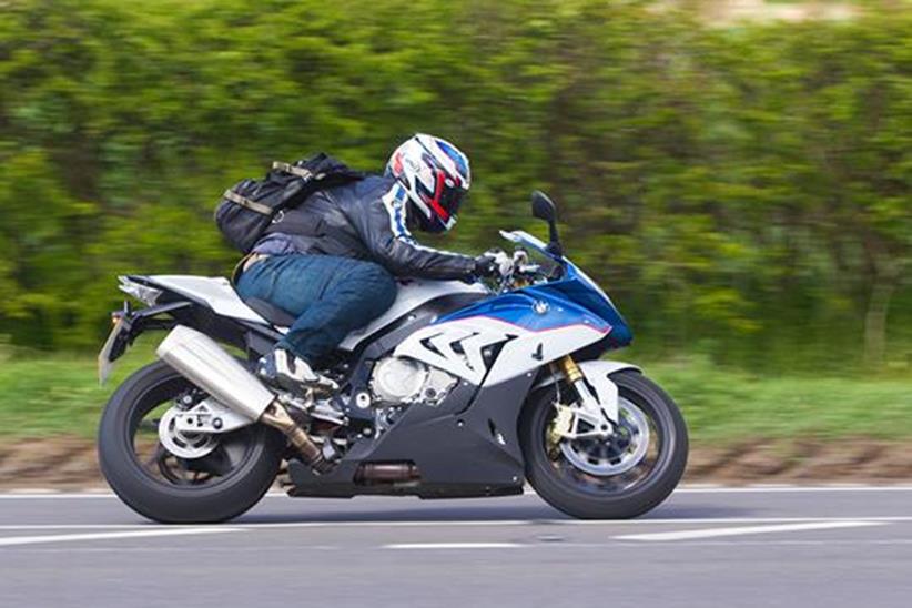 Side-on cornering shot of Editor Richard Newland on his 2015 BMW S1000RR superbike long-termer