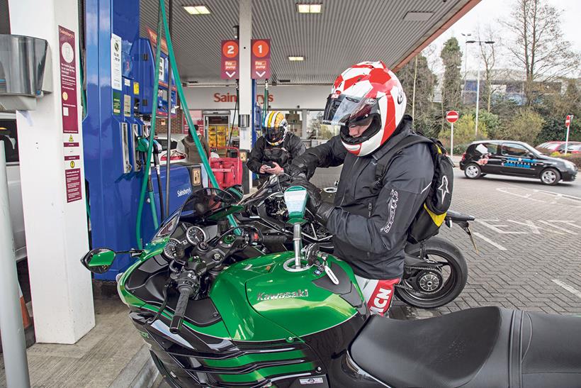 Filling a Kawasaki with petrol