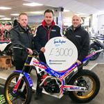 Trials star and dealership raise thousands for charity