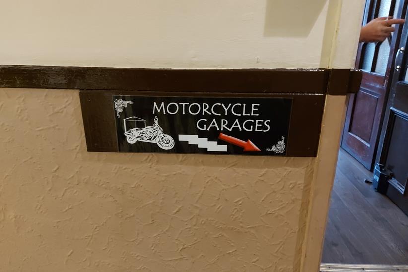 A sign down to the motorcycle garages