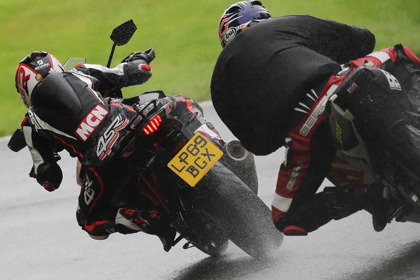 The KTM is joined by another bike through Cadwell Park's Hall Bends