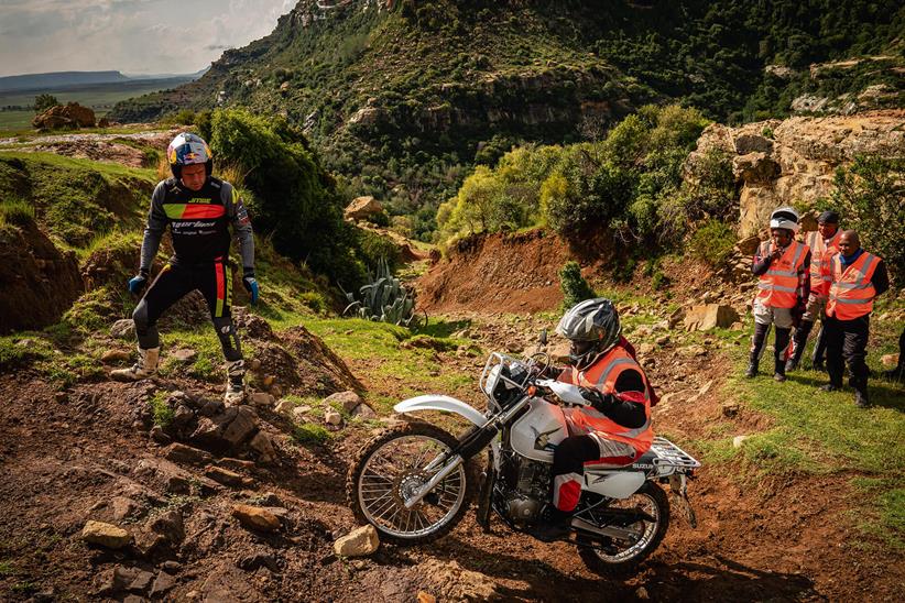 Dougie Lampkin lends his expertise to a Riders for Health worker